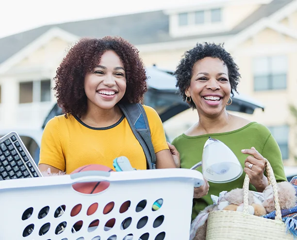 Mother and daughter moving into college dorm