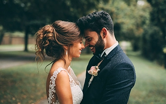 Couple standing together at an outdoor wedding