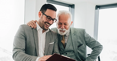 Professionals reviewing documents together, representing estate and legacy planning