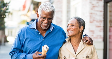 Pair walking together, representing retirement planning