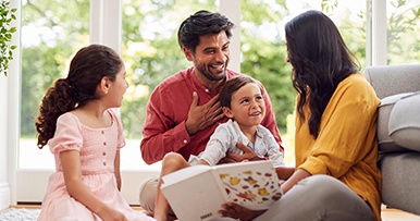 Family gathered together indoors, representing preserving a financial legacy