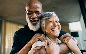 Older couple standing together indoors